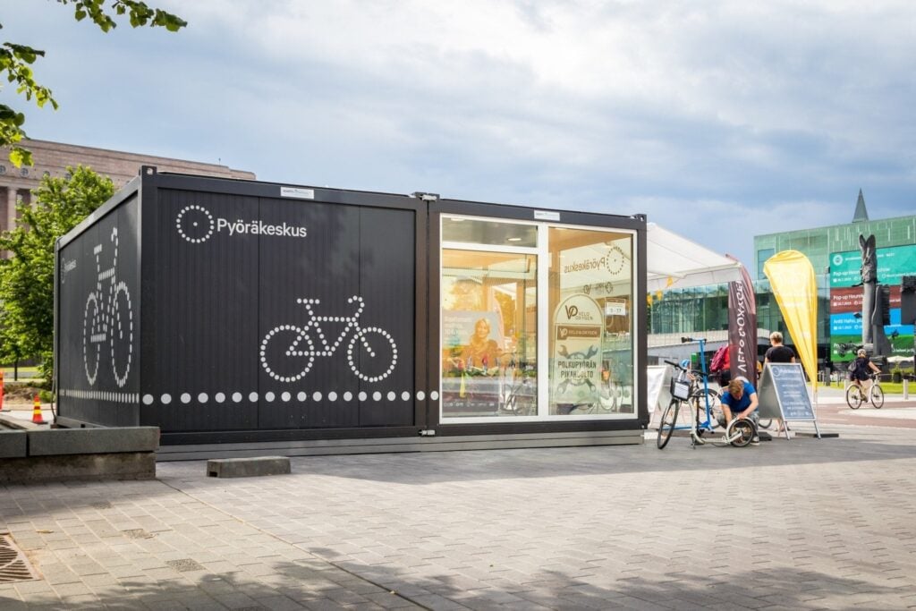 Glass-fronted bicycle service container facility